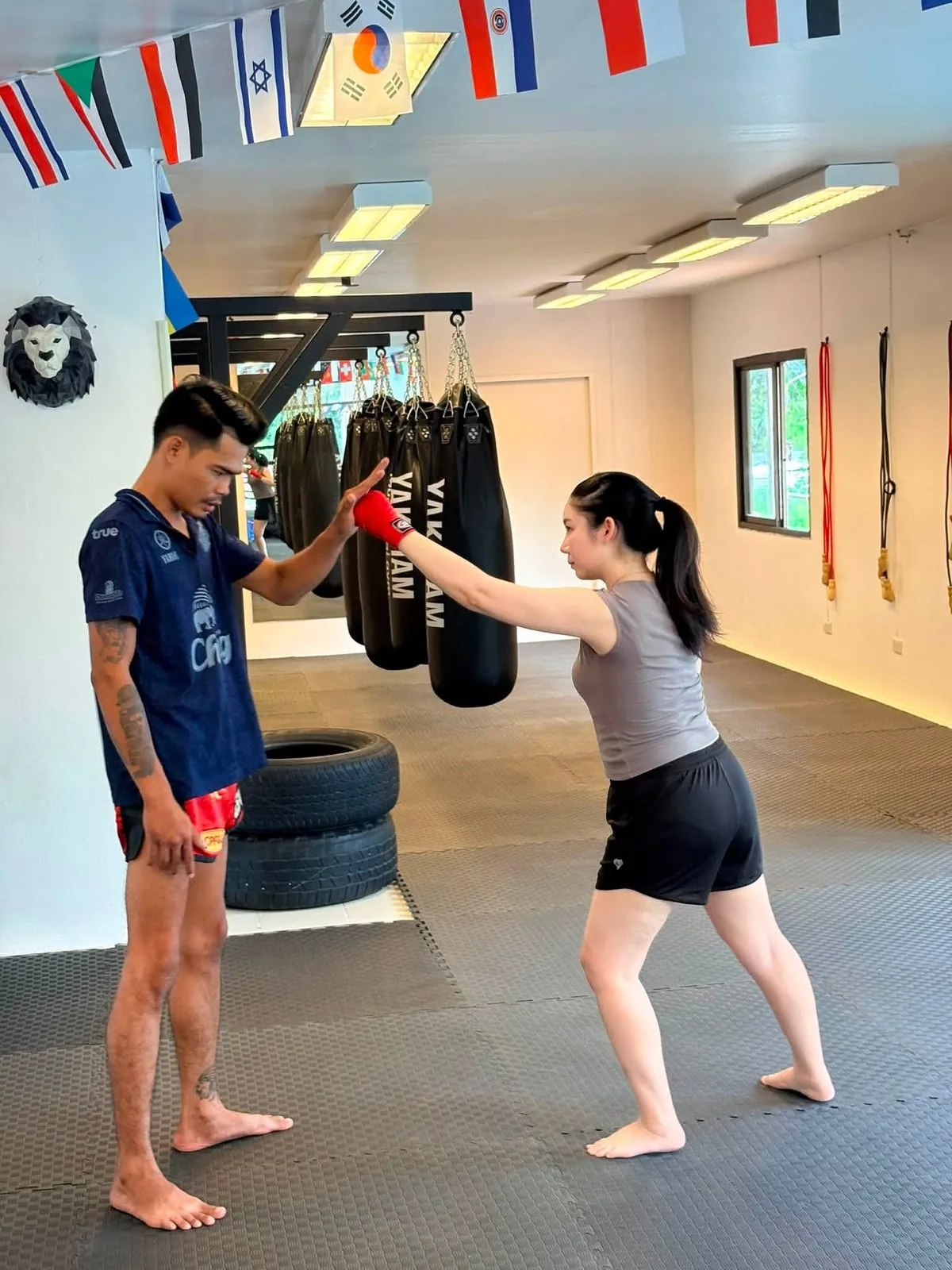 Trainer holding pads for a student