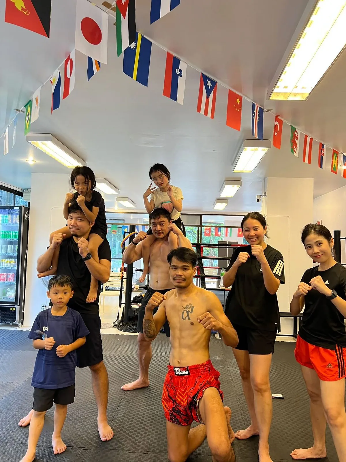 Families and kids training Muay Thai together in Chiang Mai